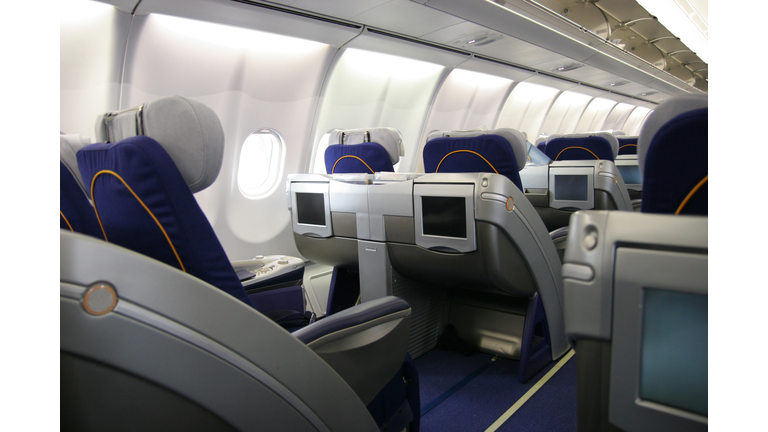 Business class airliner seat with multimedia monitor