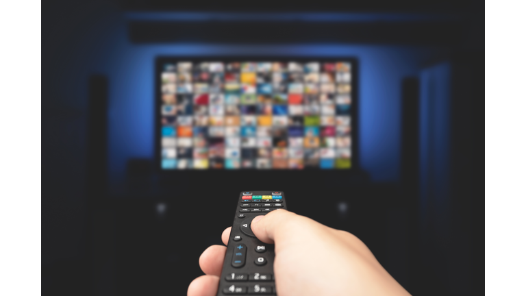 Multimedia video concept on TV set in dark room