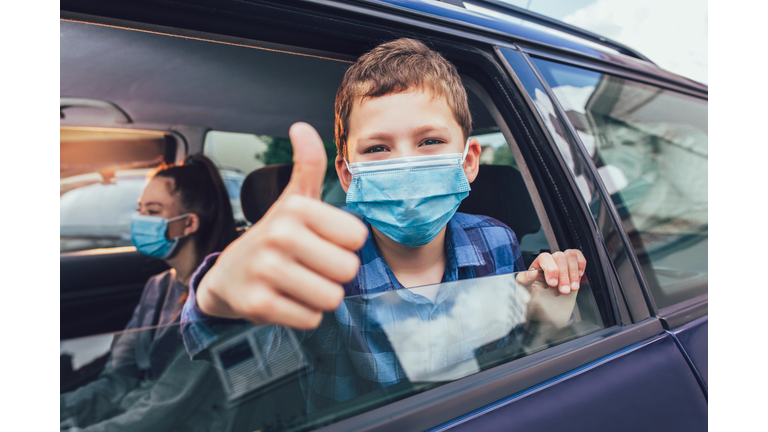 Kids are travelling in car during coronavirus outbreak