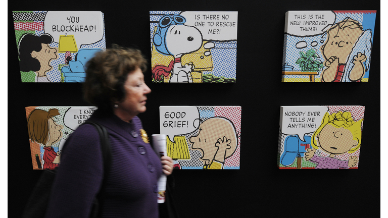 A visitor walks past a display of "Peanu