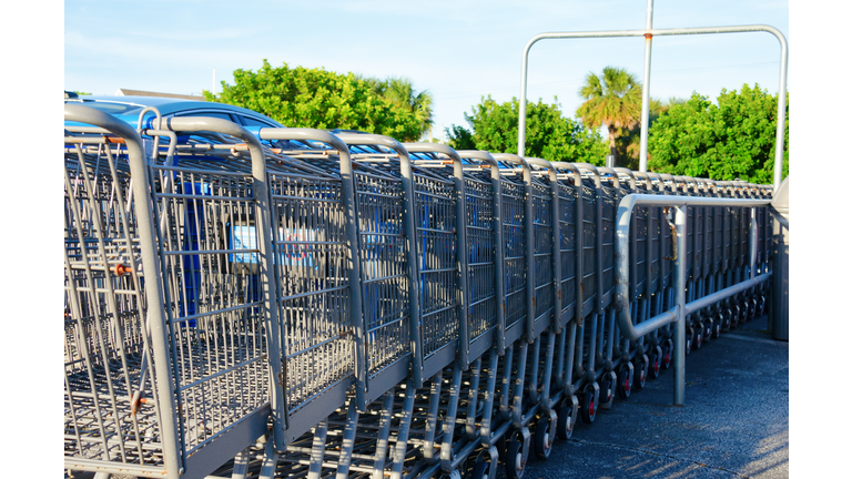 Row of shopping carts in outdoor return station
