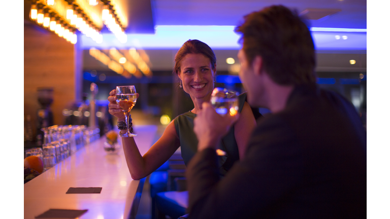 Couple drinking wine in a hotel bar