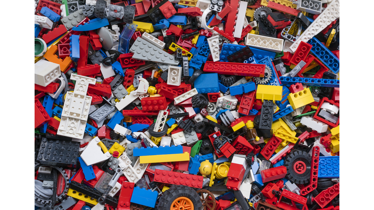 Cluttered pile of many colourful Lego bricks