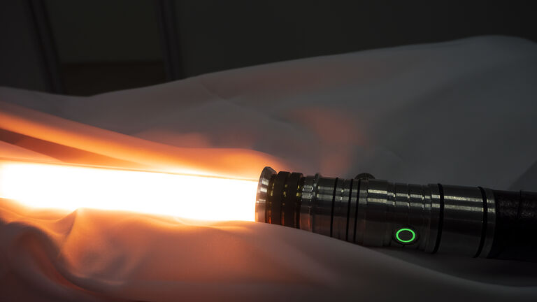 A lightsaber with the blade out. Not as clumsy or random as a blaster. An elegant weapon for a more civilized age.