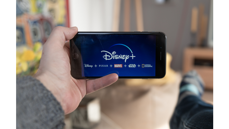 Disney+ startscreen on  mobile phone. Disney+ online video, content streaming subscription service. Disney plus, Star wars, Marvel, Pixar, National Geographic.