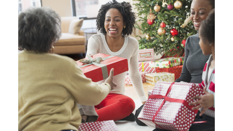 Family opening Christmas presents together