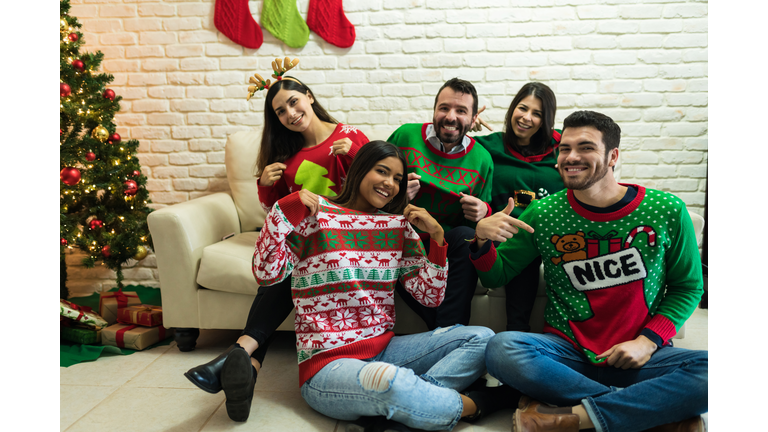 Friends In Ugly Sweater Celebrating Christmas Together At Home