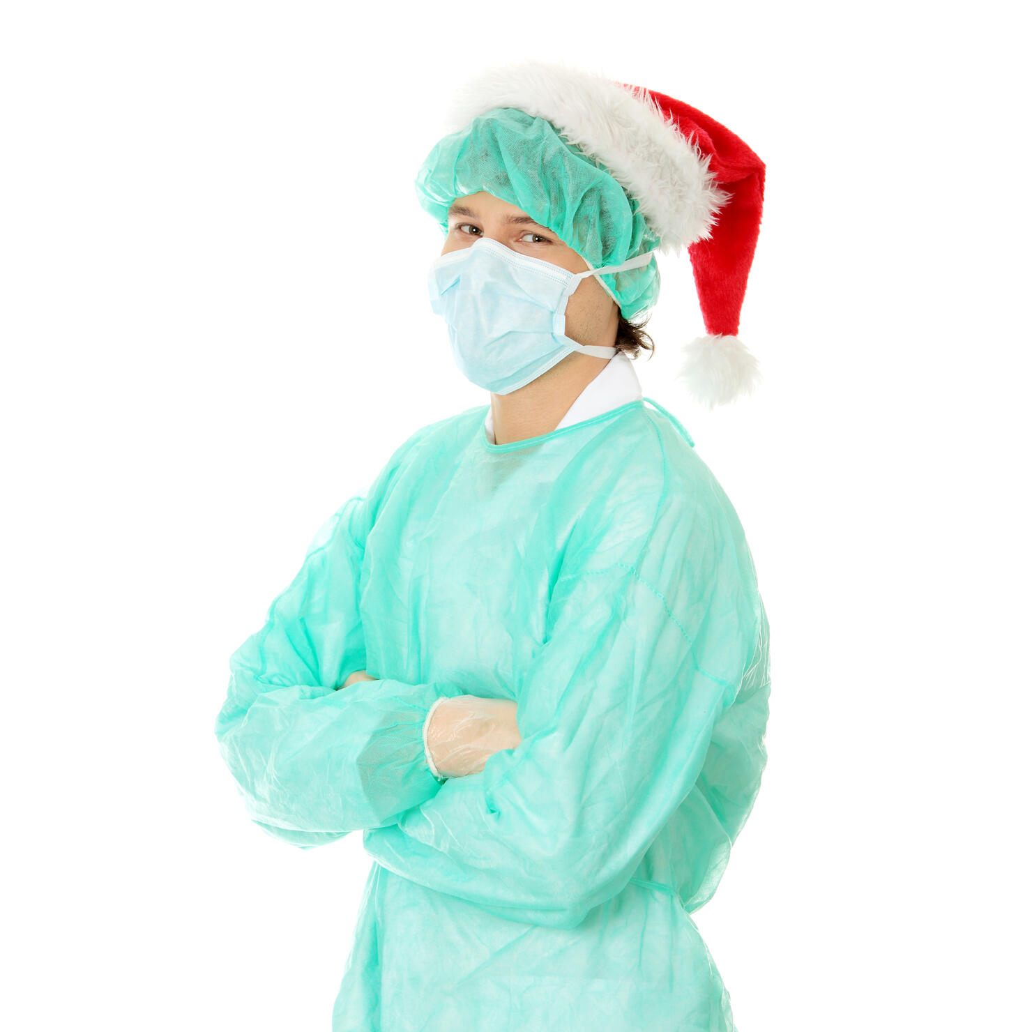 Portrait Of Man Wearing Surgical Mask And Santa Hat Standing Against White Background