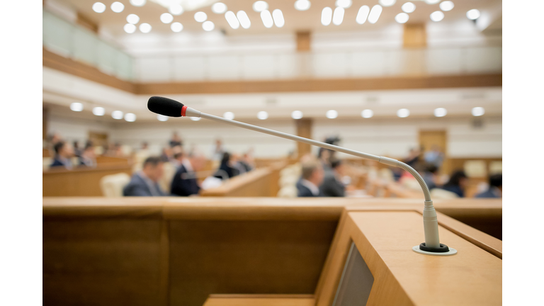 Session of Government. Conference room or seminar meeting room in business event. Academic classroom training course in lecture hall. blurred businessmen talking. modern bright office indoor