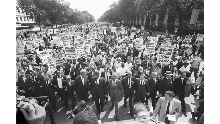 The clergyman and civil rights leader Martin Luther KIng (3rd from left) and other black and white civil right leaders march 28 August 1963 on the Mall in Washington DC during the "March on Washington". King said the march was "the greatest demonstration of freedom in the history of the United States." Martin Luther King was assassinated on 04 April 1968 in Memphis, Tennessee. James Earl Ray confessed to shooting King and was sentenced to 99 years in prison. King's killing sent shock waves through American society at the time, and is still regarded as a landmark event in recent US history. (Photo by - / AFP) (Photo credit should read -/AFP via Getty Images)