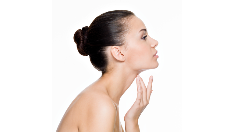 Beautiful woman cares for the neck