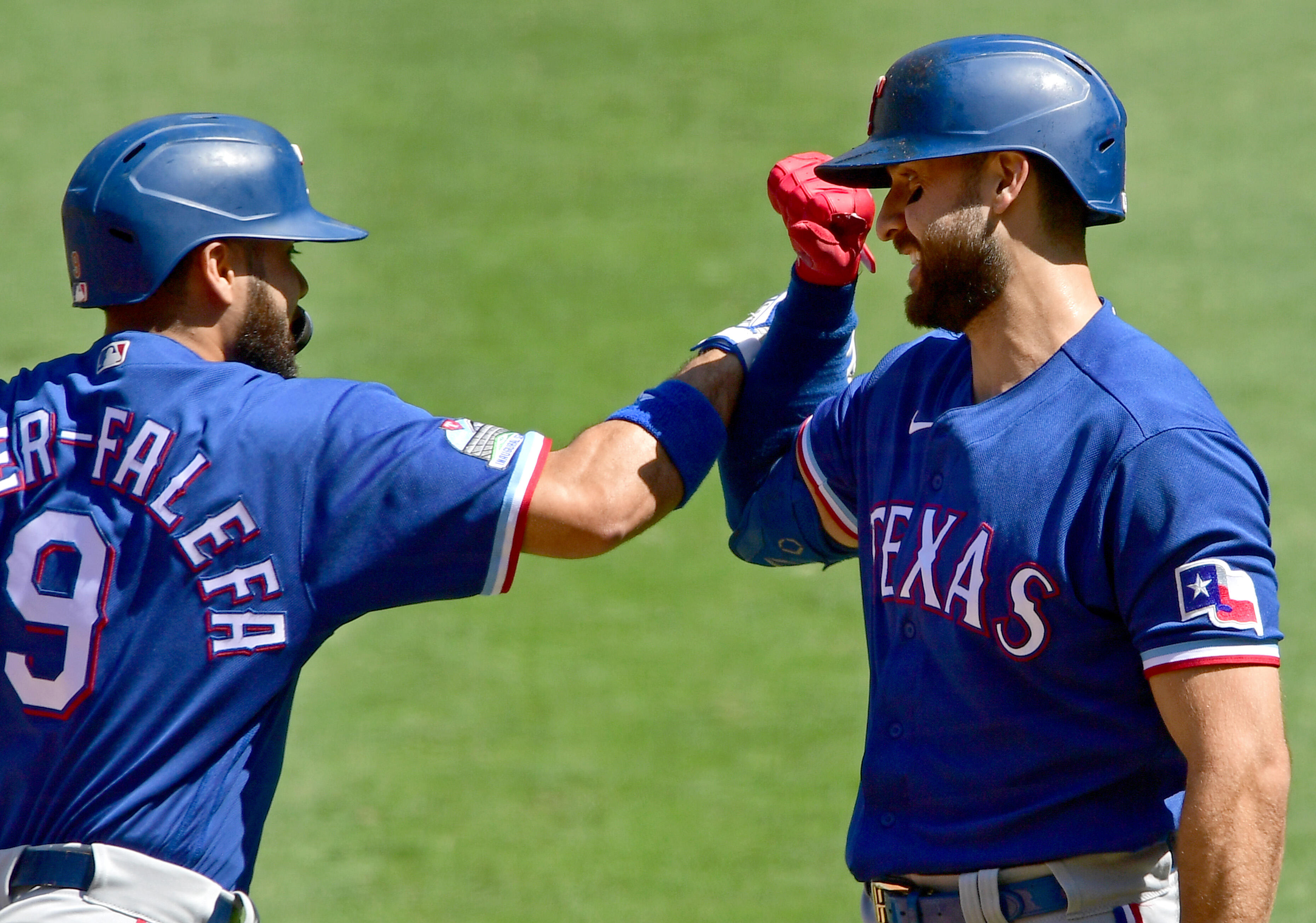 Texas Rangers' Isiah Kiner-Falefa connects for a two-run single to