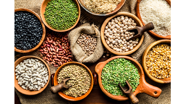 Top view of leguminous seeds on rustic wood table