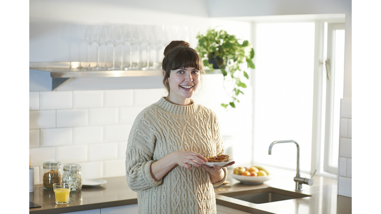 Portrait of woman in zero waste kitchen at breakfast.