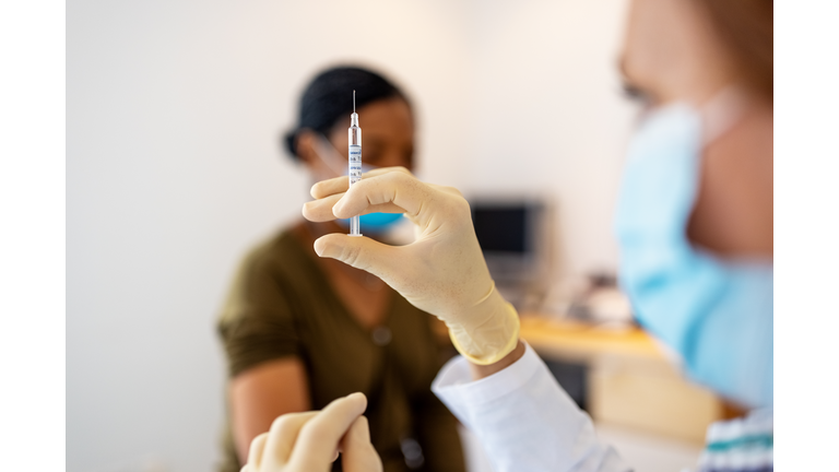 Doctor preparing flu or coronavirus injection