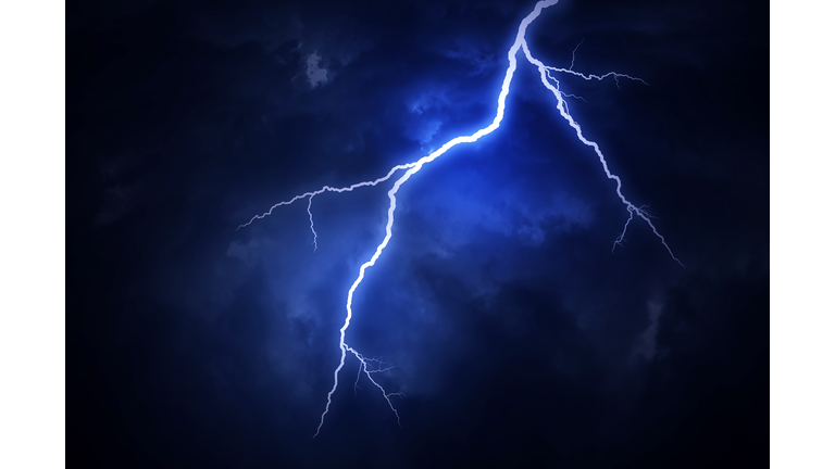 A lightning strike on a cloudy dramatic stormy sky