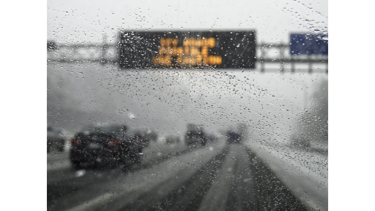 hazardous weather condition on the road seen through windshield