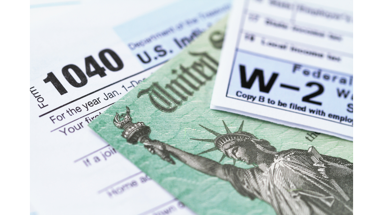 IRS tax forms with tax refund check