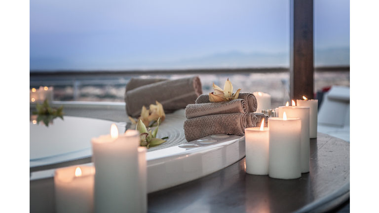 Bath and candles in luxury hotel room