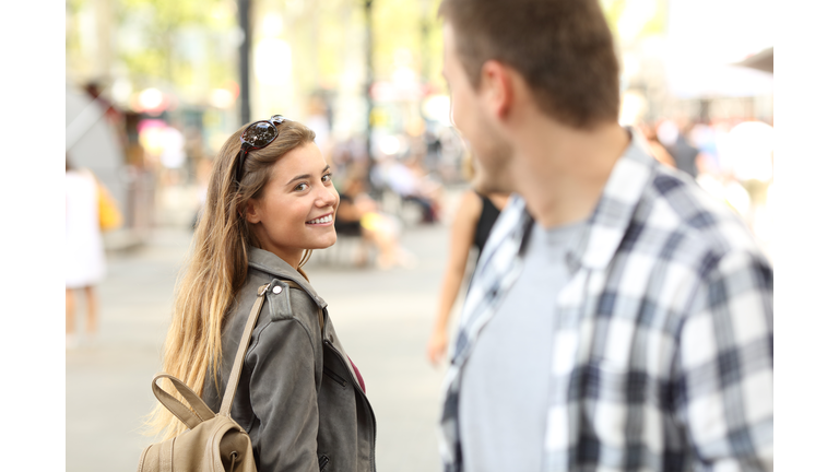 Strangers girl and guy flirting on the street