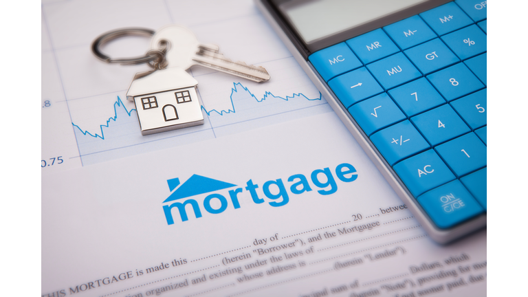 An empty mortgage application form with house key