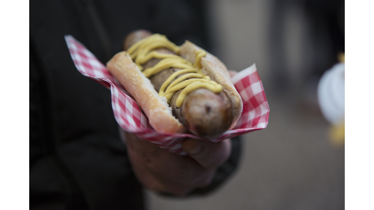 Man holding Bratwurst at a German Christmas market