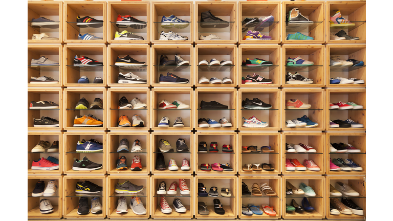 Different shoes displayed in a shoe shop.