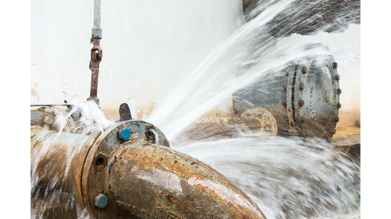 metal pipe with valve is leaking in water treatment plant