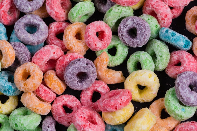 Colorful Fruit O shaped cereal on a black background