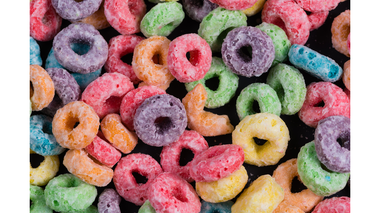 Colorful Fruit O shaped cereal on a black background