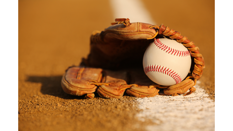 Baseball in a Glove on the Infield