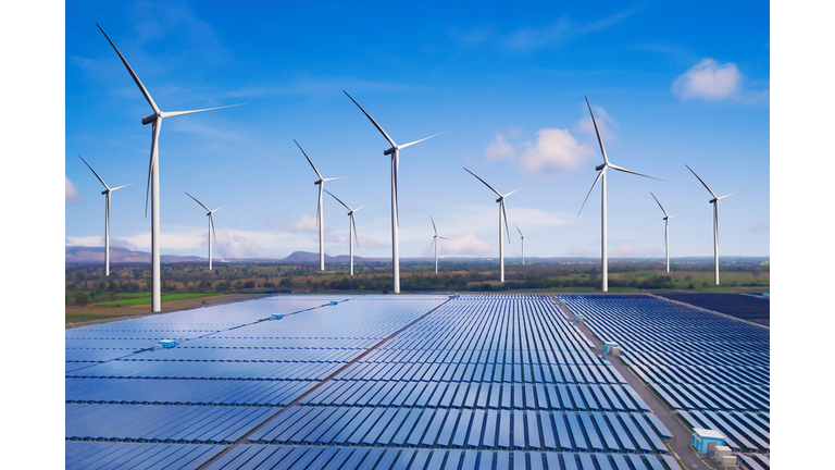 Solar panel and wind turbine farm clean energy.