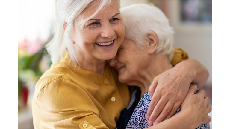 Woman spending time with her elderly mother