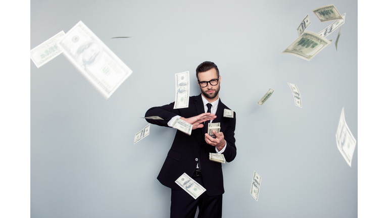 Spectacles jackpot entrepreneur economist banker chic posh manager jacket concept. Handsome confident cunning clever wealthy rich luxury guy holding wasting stack of money isolated on gray background