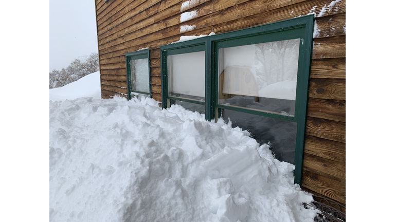 Extremely deep snow piled over the windowsills