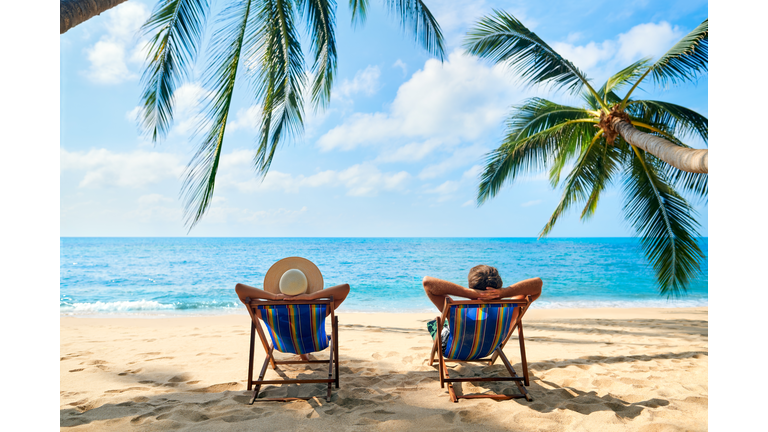 Couple relax on the beach enjoy beautiful sea on the tropical island