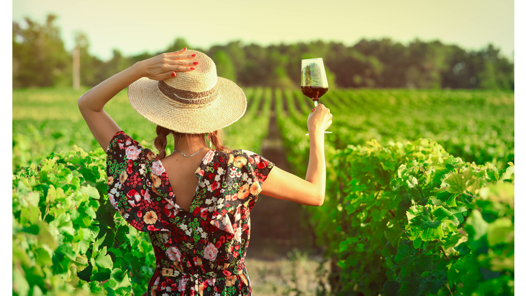 Asian woman drinking red wine