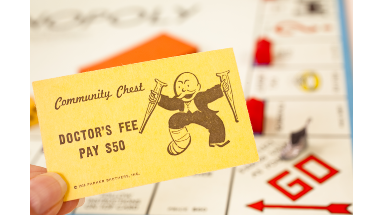 Games: Monopoly board game. 'Doctor's Fee' community chest card.