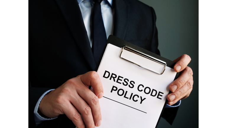 Manager is holding Dress code policy.