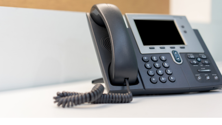 Close-Up Of Telephone On Table