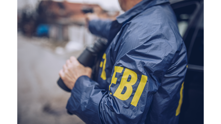 An FBI agent uses a gun in action