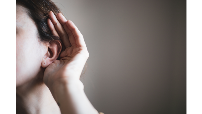 A woman's ear, listening