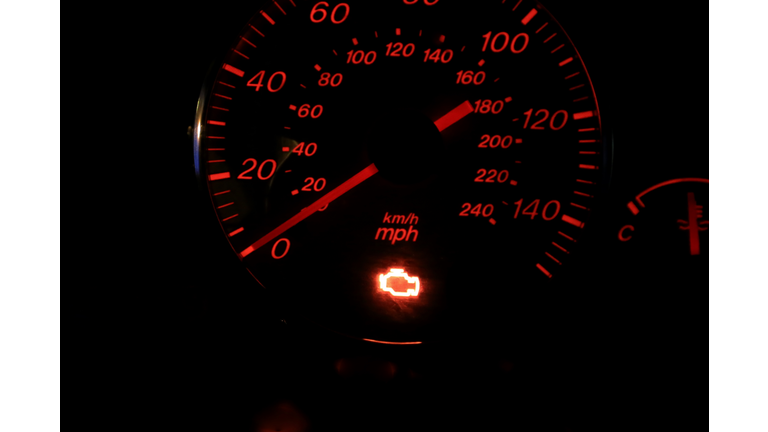 Illuminated check engine light displayed on a vehicle dashboard