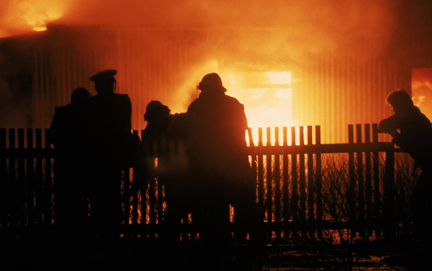 Firefighters Extinguishing House Fire