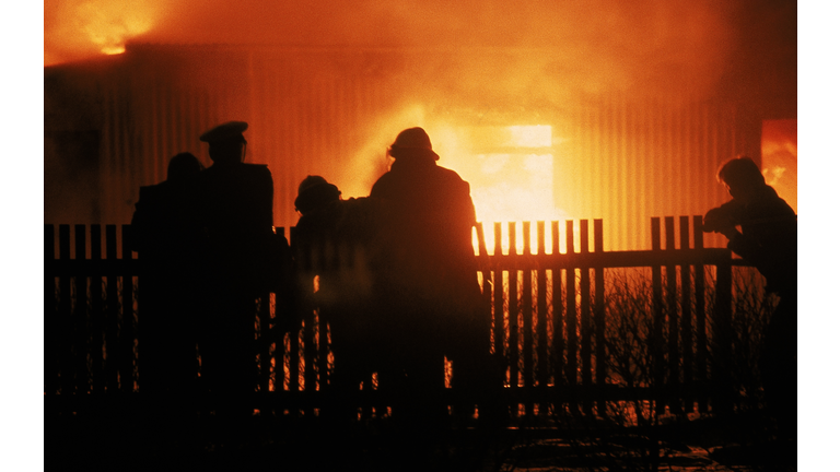 Firefighters Extinguishing House Fire