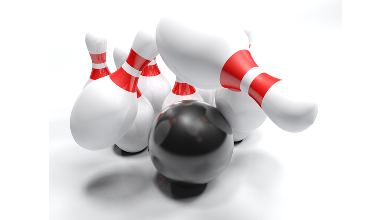 High Angle View Of Bowling Pins And Ball On White Background