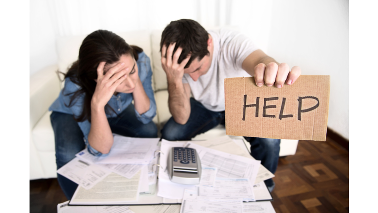 young couple in bad financial situation stress asking for help