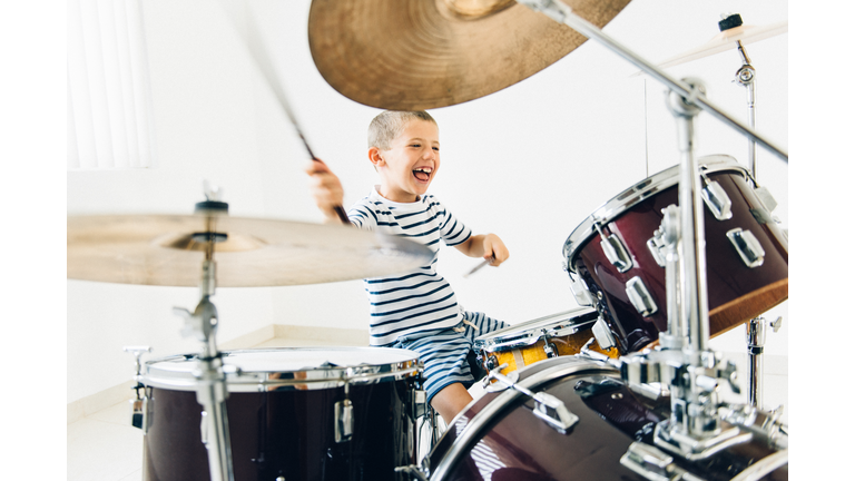 Little boy playing drums