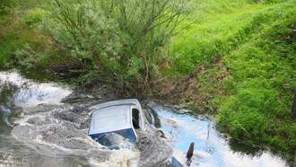National News - Woman Rescued From Sinking Car After Crashing Into Pond During Heavy Rain