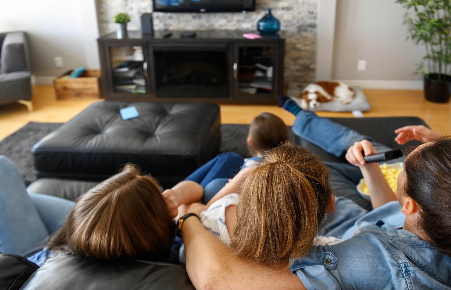 Family watching tv and using internet